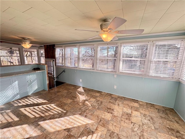 interior space featuring ceiling fan