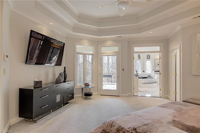 bedroom with a tray ceiling, light carpet, crown molding, and access to outside