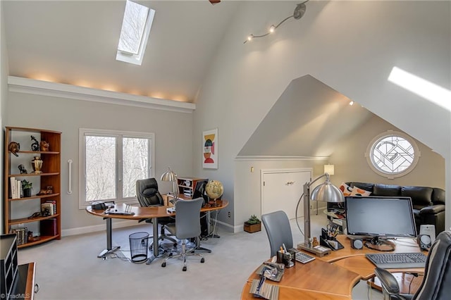 office space with baseboards, carpet floors, and high vaulted ceiling