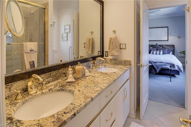 bathroom with a sink, double vanity, ensuite bath, and a shower stall