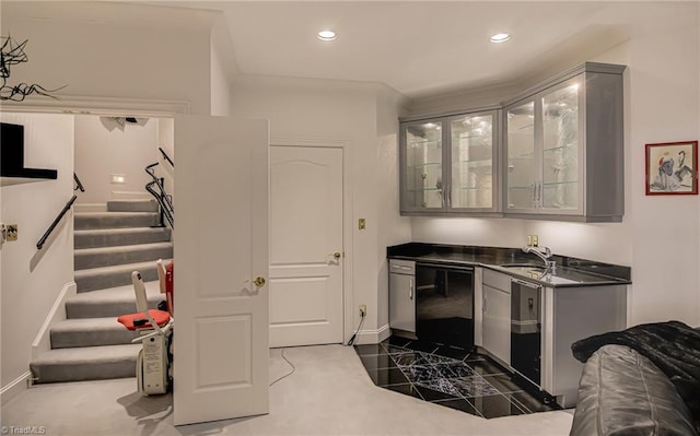 bar with a sink, baseboards, stairs, and recessed lighting