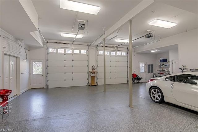 garage featuring electric panel and a garage door opener