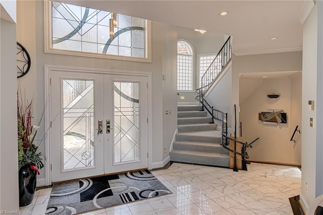 foyer entrance featuring stairway, baseboards, recessed lighting, french doors, and marble finish floor