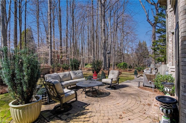 view of patio with an outdoor hangout area and a grill