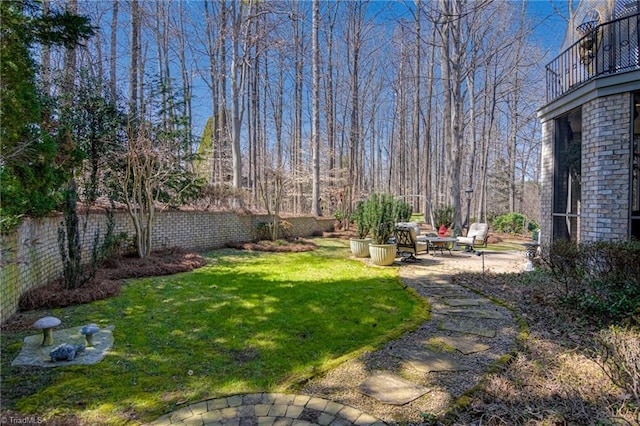 view of yard with a patio and fence