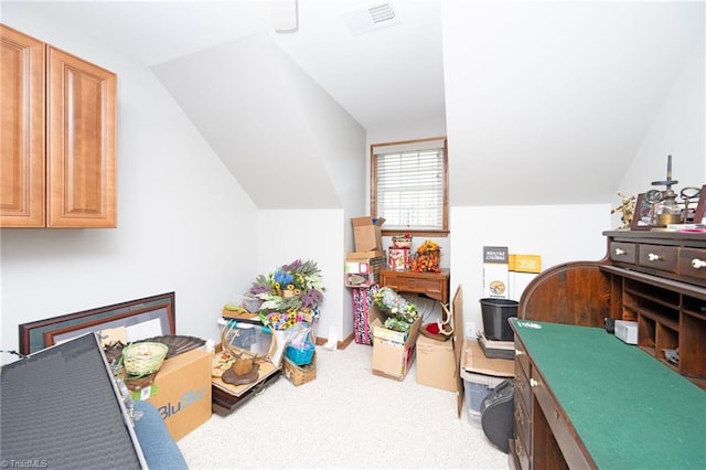 recreation room featuring visible vents, carpet floors, and vaulted ceiling