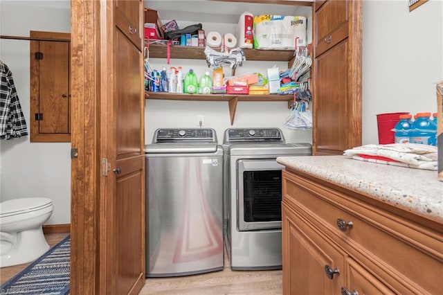 laundry area with laundry area and separate washer and dryer