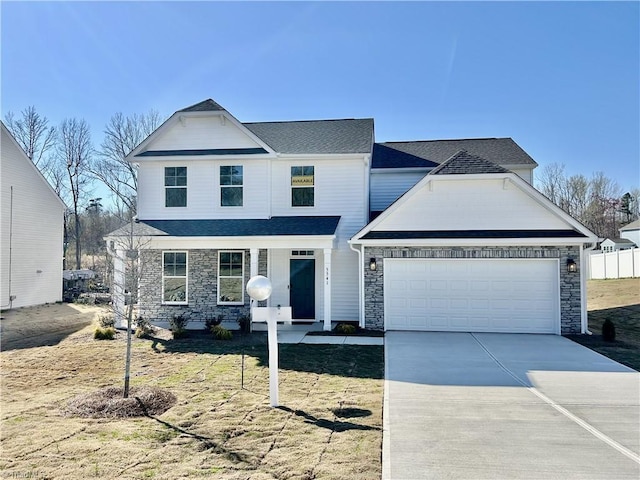 5541 Siler St, Trinity, NC 27370 - traditional-style house featuring a porch, an attached garage, driveway, and stone siding
