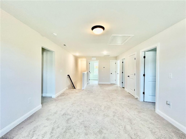 unfurnished room featuring light colored carpet