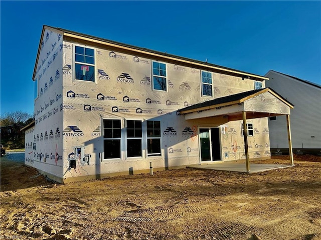 rear view of property featuring a patio