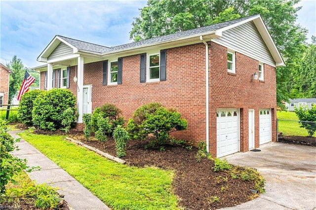 163 Ruth Ct, Winston-Salem, NC 27127 - view of front facade featuring driveway, fence, brick siding, an attached garage, and roof with shingles