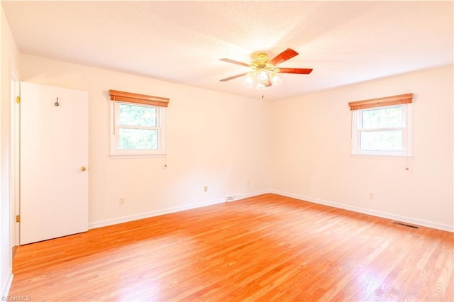 163 Ruth Ct, Winston-Salem, NC 27127 - spare room with light wood-style floors, a ceiling fan, and baseboards