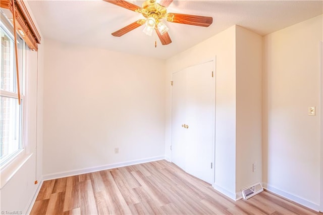 163 Ruth Ct, Winston-Salem, NC 27127 - unfurnished bedroom with light wood finished floors, baseboards, and ceiling fan