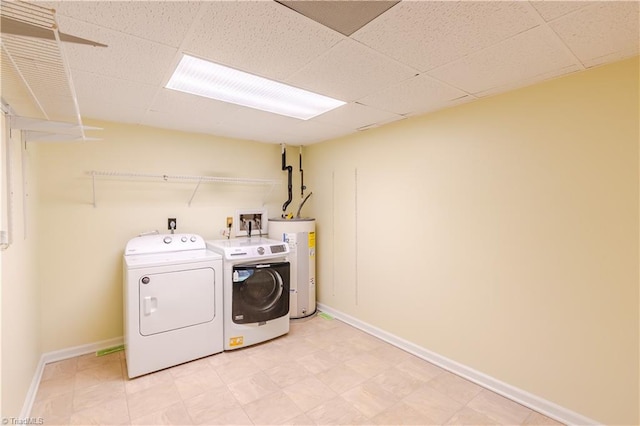 163 Ruth Ct, Winston-Salem, NC 27127 - clothes washing area featuring water heater, washer and clothes dryer, and baseboards