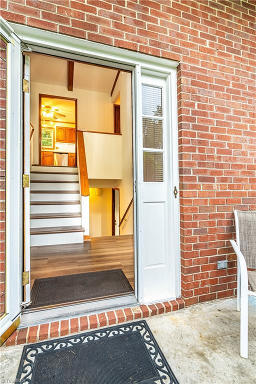 163 Ruth Ct, Winston-Salem, NC 27127 - doorway to property with brick siding