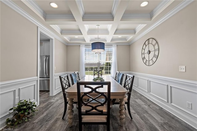 dining room with beam ceiling, ornamental molding, coffered ceiling, an inviting chandelier, and dark hardwood / wood-style flooring