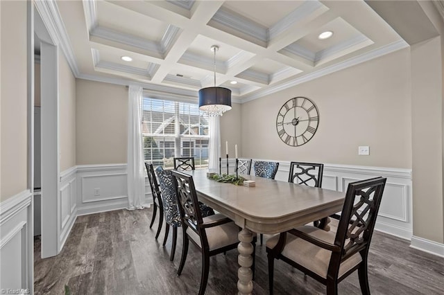 dining room with beam ceiling, ornamental molding, dark wood-type flooring, and a notable chandelier