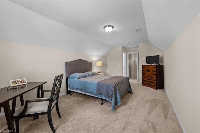 carpeted bedroom featuring lofted ceiling