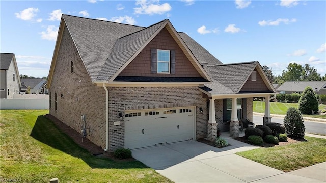 craftsman-style home with a front yard and a garage