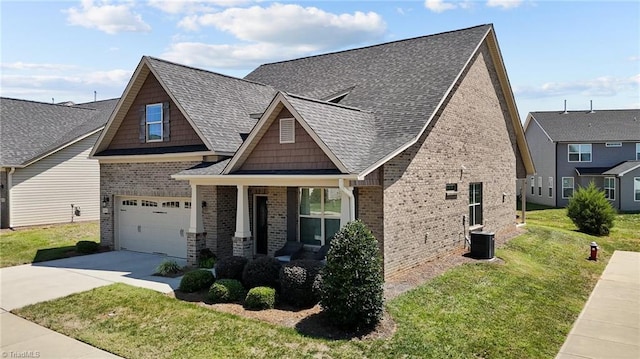 craftsman-style house featuring central AC, a front yard, and a garage