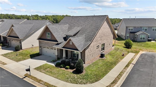 view of front of home featuring a front lawn and a garage