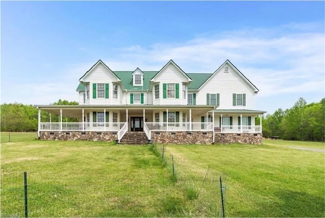 farmhouse-style home with covered porch and a front lawn