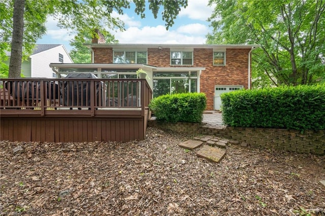 1315 Waybridge Ln, Winston-Salem, NC 27103 - rear view of property featuring a wooden deck, brick siding, and a chimney