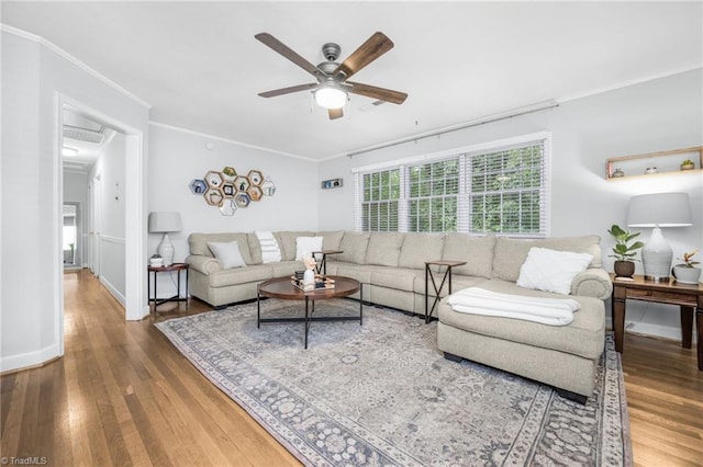 1315 Waybridge Ln, Winston-Salem, NC 27103 - living area featuring wood finished floors, a ceiling fan, and crown molding