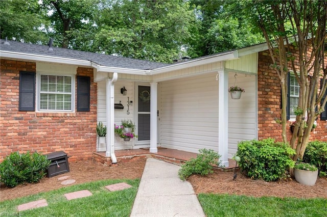 1315 Waybridge Ln, Winston-Salem, NC 27103 - view of exterior entry with brick siding, covered porch, and a shingled roof
