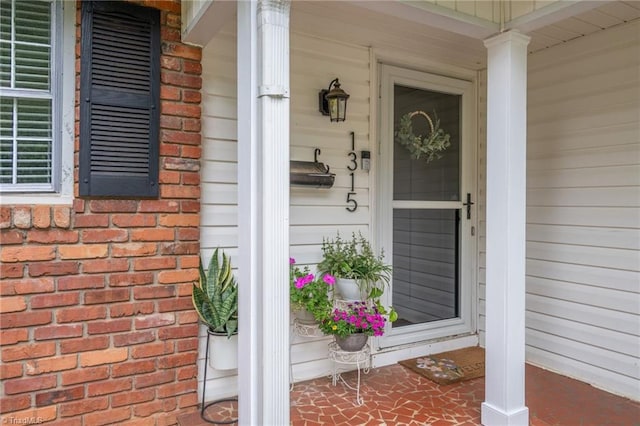 1315 Waybridge Ln, Winston-Salem, NC 27103 - view of exterior entry featuring a porch and brick siding