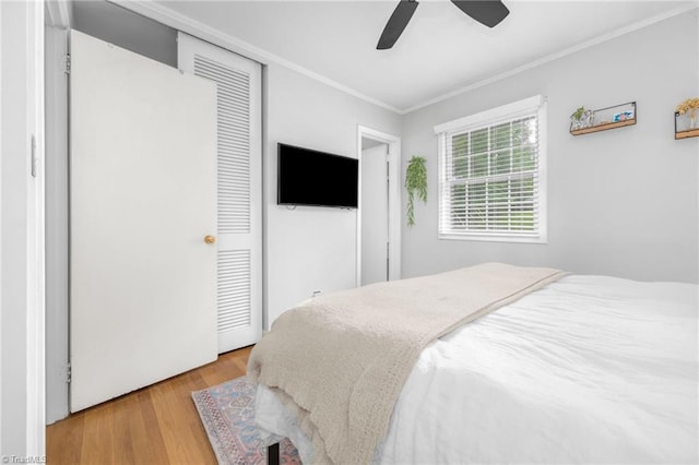 1315 Waybridge Ln, Winston-Salem, NC 27103 - bedroom with ornamental molding, wood finished floors, a closet, and a ceiling fan