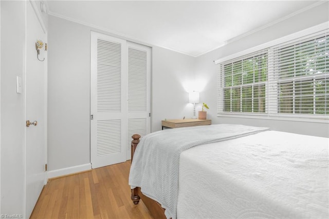 1315 Waybridge Ln, Winston-Salem, NC 27103 - bedroom with crown molding, a closet, and wood finished floors