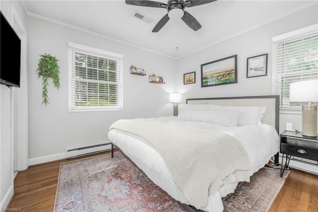 1315 Waybridge Ln, Winston-Salem, NC 27103 - bedroom featuring a baseboard radiator, ornamental molding, wood finished floors, and a ceiling fan
