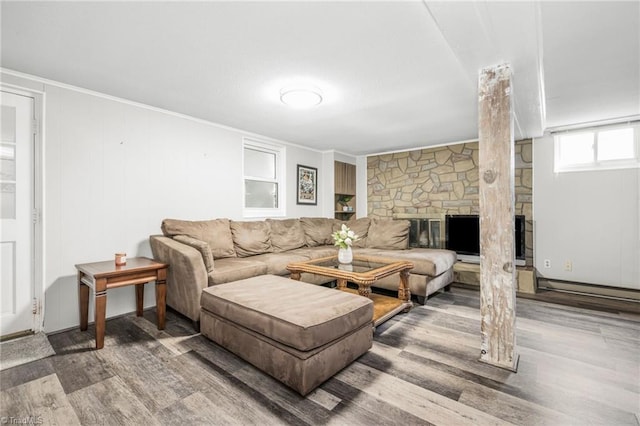 1315 Waybridge Ln, Winston-Salem, NC 27103 - living room featuring wood finished floors, a stone fireplace, and crown molding