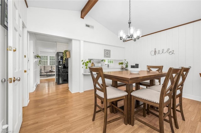 1315 Waybridge Ln, Winston-Salem, NC 27103 - dining room featuring a chandelier and light wood-style flooring