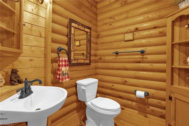 2235 Buck Mountain Rd, Purlear, NC 28665 - half bathroom featuring a sink and rustic walls