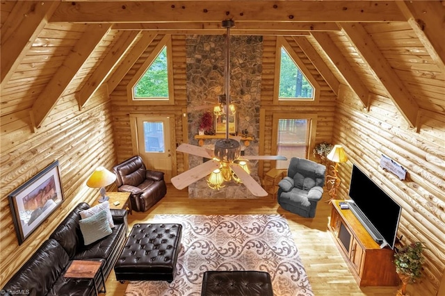 2235 Buck Mountain Rd, Purlear, NC 28665 - living area with log walls, light wood-type flooring, high vaulted ceiling, a wood ceiling with exposed beams, and a fireplace