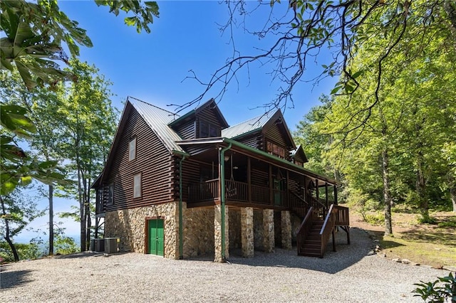 2235 Buck Mountain Rd, Purlear, NC 28665 - view of home's exterior with stone siding, stairs, a metal roof, and log exterior