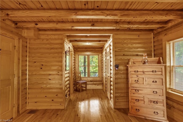 2235 Buck Mountain Rd, Purlear, NC 28665 - corridor featuring light wood-style flooring, plenty of natural light, log walls, and a wooden ceiling with exposed beams