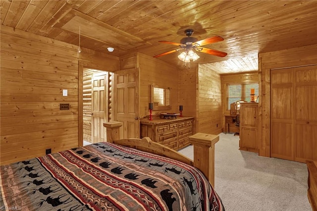 2235 Buck Mountain Rd, Purlear, NC 28665 - bedroom featuring wooden ceiling, wood walls, light colored carpet, and ceiling fan