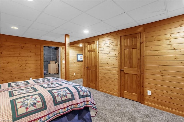 2235 Buck Mountain Rd, Purlear, NC 28665 - carpeted bedroom with wooden walls, a paneled ceiling, and recessed lighting