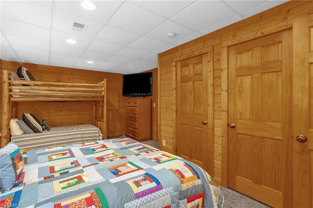 2235 Buck Mountain Rd, Purlear, NC 28665 - carpeted bedroom featuring wood walls and a drop ceiling