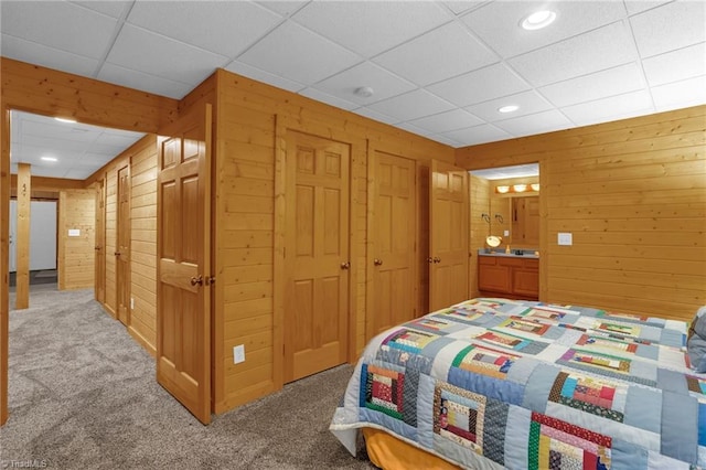 2235 Buck Mountain Rd, Purlear, NC 28665 - bedroom with wood walls, light colored carpet, a drop ceiling, recessed lighting, and a closet
