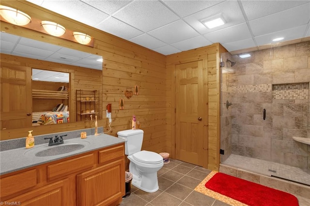 2235 Buck Mountain Rd, Purlear, NC 28665 - full bath featuring a shower stall, tile patterned floors, vanity, a drop ceiling, and wood walls