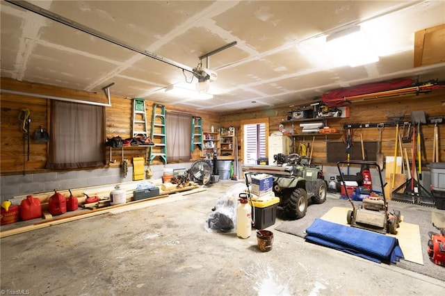 2235 Buck Mountain Rd, Purlear, NC 28665 - garage featuring a garage door opener and a workshop area