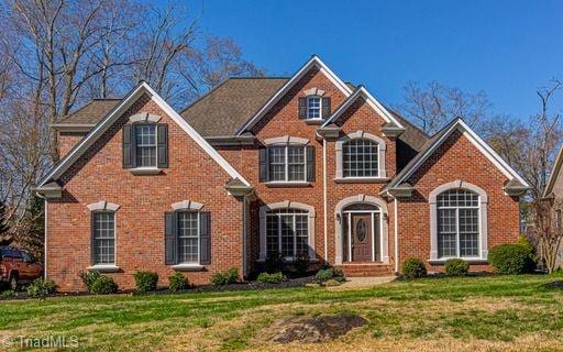 front facade with a front lawn