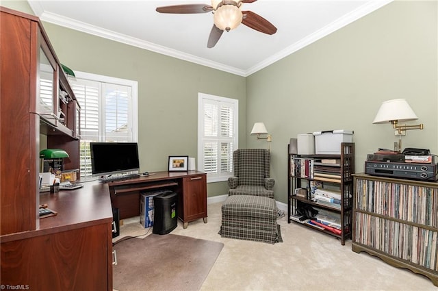 carpeted home office featuring plenty of natural light, crown molding, and ceiling fan