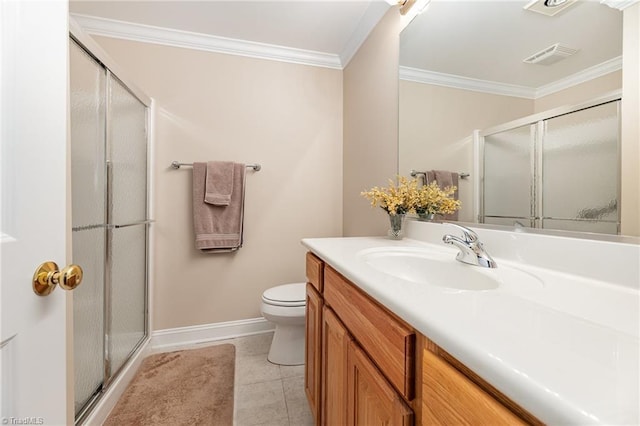 bathroom with tile patterned flooring, vanity, a shower with door, and crown molding