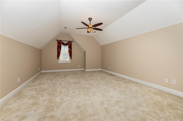 additional living space with carpet flooring, vaulted ceiling, and ceiling fan