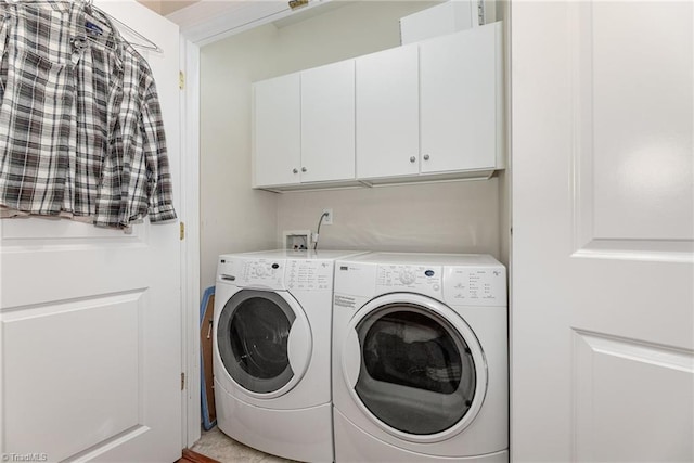 laundry area with independent washer and dryer